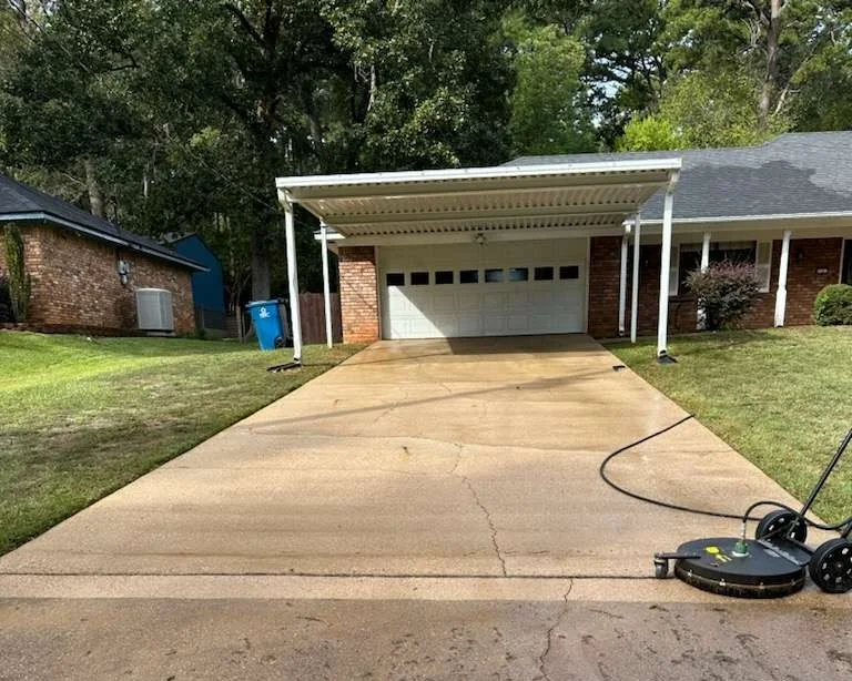 Residential driveway with pressure washing equipment